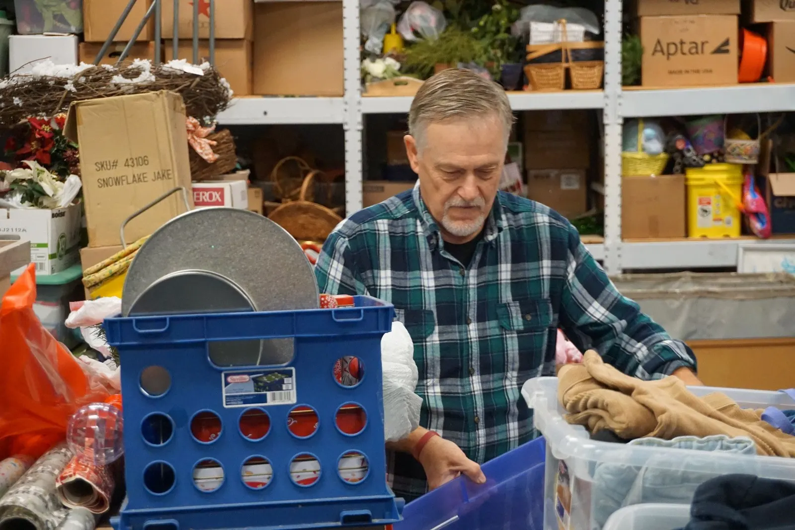 A volunteer sorting donated goods