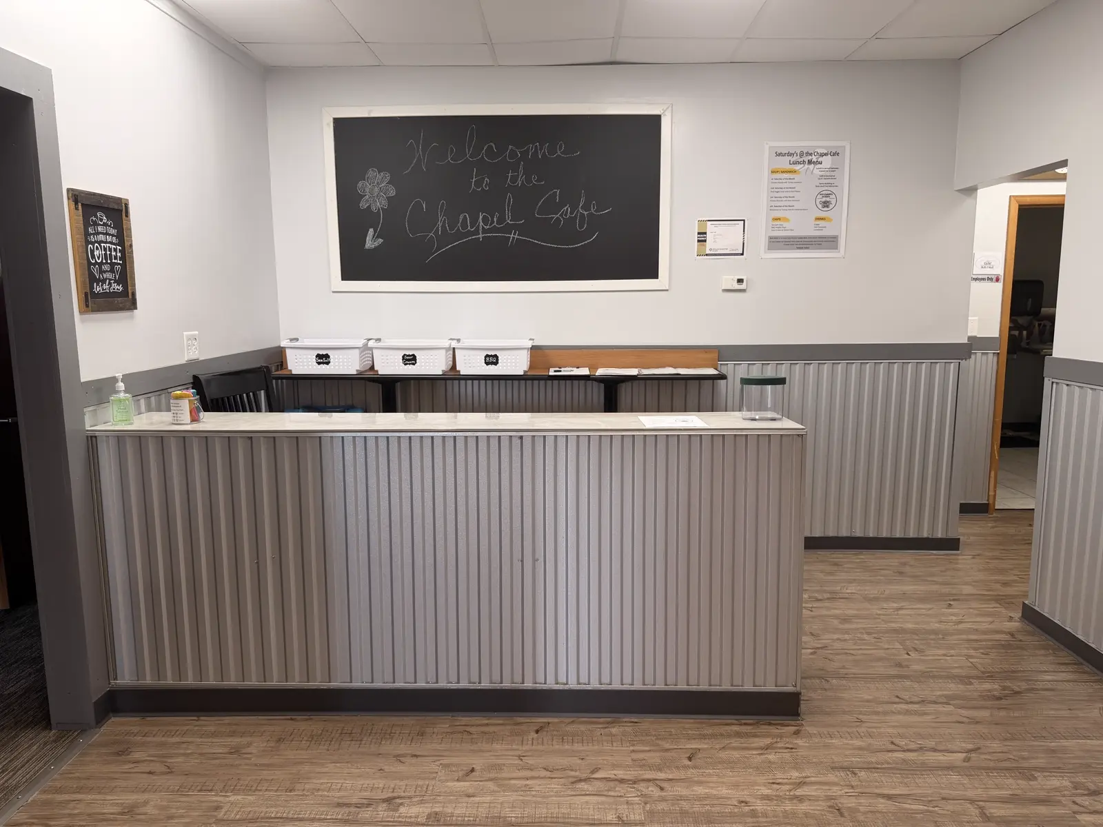 The serving counter, with a Welcome to the Chapel Cafe chalkboard on the wall